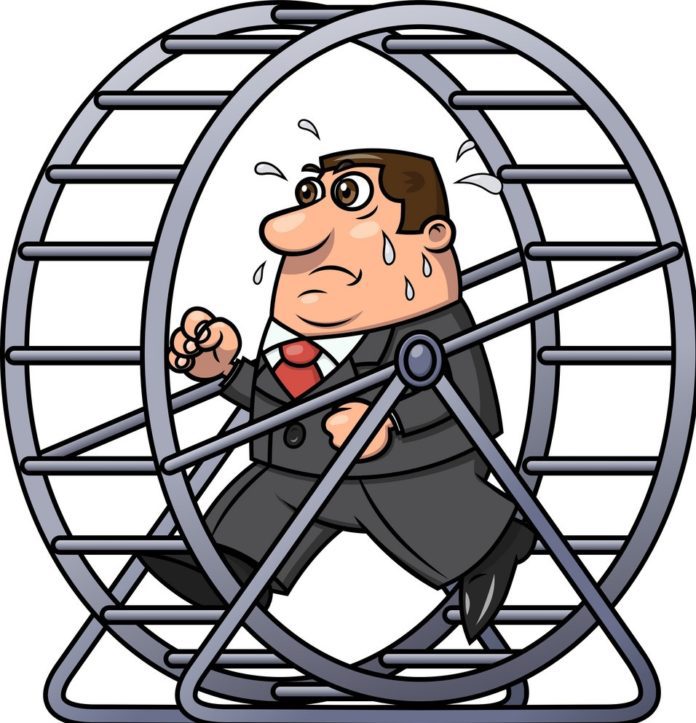 Man running on hamster wheel. Lifestyle creep for increasing spending when income increases.